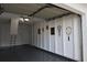 Spacious garage featuring clean epoxy flooring and decorated walls, providing functional space at 5395 Dover Village Ln # 305, Orlando, FL 32812