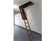 Garage with a pull-down ladder to access attic storage at 5395 Dover Village Ln # 305, Orlando, FL 32812