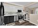 Modern kitchen with stainless steel appliances, dark hardwood floors and light countertops at 5395 Dover Village Ln # 305, Orlando, FL 32812
