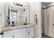 Elegant bathroom featuring double sinks, granite countertops, and a shower with curtain at 557 Lake Cove Pointe Cir, Winter Garden, FL 34787
