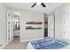 Bedroom with ensuite bathroom and shoe racks, blending comfort with practical storage solutions at 557 Lake Cove Pointe Cir, Winter Garden, FL 34787