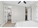 Bedroom with an ensuite bathroom and view of wet bar, providing convenient access to amenities at 557 Lake Cove Pointe Cir, Winter Garden, FL 34787