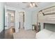 Bright bedroom with a custom closet and a glimpse into the adjacent bathroom at 557 Lake Cove Pointe Cir, Winter Garden, FL 34787