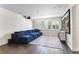 Entertainment room with a blue velvet sectional and projector setup, perfect for movie nights at 557 Lake Cove Pointe Cir, Winter Garden, FL 34787