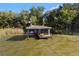 Charming screened dock featuring bench seating for relaxing by the water at 557 Lake Cove Pointe Cir, Winter Garden, FL 34787