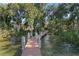 Wooden dock with sturdy posts provides tranquil access to the water at 557 Lake Cove Pointe Cir, Winter Garden, FL 34787