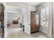 Inviting entryway showcasing travertine floors, neutral paint, and lots of natural light at 557 Lake Cove Pointe Cir, Winter Garden, FL 34787