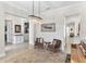 Open-concept living area with comfortable seating, chandelier lighting, and seamless transition between spaces at 557 Lake Cove Pointe Cir, Winter Garden, FL 34787