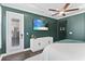 Well-lit bedroom offering a view of the outdoor patio and access to the en-suite at 557 Lake Cove Pointe Cir, Winter Garden, FL 34787