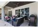 Inviting outdoor patio with comfortable seating and a grill, perfect for entertaining at 557 Lake Cove Pointe Cir, Winter Garden, FL 34787