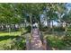 Wooden walkway leads to private waterfront access and a charming boat dock at 557 Lake Cove Pointe Cir, Winter Garden, FL 34787