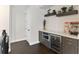 Convenient wet bar area with a microwave and wine cooler, ideal for entertaining guests at 557 Lake Cove Pointe Cir, Winter Garden, FL 34787