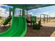 Community playground featuring swings and a slide in a safe, wood-chipped play area at 6055 Vision Rd, St Cloud, FL 34771