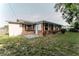 The backyard has a small concrete patio and lots of green space with mature trees at 635 San Lanta Cir, Sanford, FL 32771