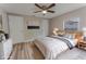 Cozy bedroom featuring a ceiling fan, neutral walls, and light-colored floors at 635 San Lanta Cir, Sanford, FL 32771