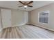 Bedroom featuring a ceiling fan, neutral walls, and light-colored floors at 635 San Lanta Cir, Sanford, FL 32771