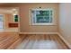 Bright dining area featuring light hardwood floors and a large window with a view of the yard at 635 San Lanta Cir, Sanford, FL 32771