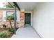 A front door and entryway featuring brick and painted finishes at 635 San Lanta Cir, Sanford, FL 32771