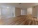 Open living space with newly installed hardwood floors, offering a seamless flow and modern aesthetic at 635 San Lanta Cir, Sanford, FL 32771
