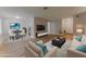 Comfortable living space featuring hardwood floors, modern decor, and an adjacent dining area at 635 San Lanta Cir, Sanford, FL 32771