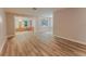 Spacious living room with light hardwood floors, ready for your personal touch and decor at 635 San Lanta Cir, Sanford, FL 32771