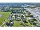 A beautiful suburban community showcased in an aerial view near green spaces and a scenic lake at 642 Carver Dr, Lake Wales, FL 33853