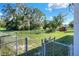 View of the backyard with an opening to a field at 642 Carver Dr, Lake Wales, FL 33853
