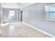 Bedroom with two windows, neutral paint, and tile flooring provides a calm space at 642 Carver Dr, Lake Wales, FL 33853