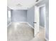 Bright bedroom features tile flooring, neutral paint, and natural light from window at 642 Carver Dr, Lake Wales, FL 33853
