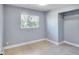 Bedroom with closet, neutral paint, tile flooring and natural light at 642 Carver Dr, Lake Wales, FL 33853