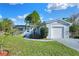 Inviting single-story home showcasing a well-maintained lawn, new paint, and an attached single-car garage at 642 Carver Dr, Lake Wales, FL 33853