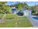 Charming single-story home with a fenced yard, freshly painted exterior, and well-manicured landscaping at 642 Carver Dr, Lake Wales, FL 33853