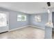Bright living room with a large windows for natural light and neutral-toned walls and flooring at 642 Carver Dr, Lake Wales, FL 33853