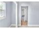 Room features neutral paint, tile flooring and offers a view to the garage at 642 Carver Dr, Lake Wales, FL 33853