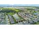 A scenic aerial view showcases a community with ponds and natural landscapes, offering a serene living environment at 646 Marsh Reed Dr, Winter Garden, FL 34787