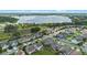 Aerial view of a neighborhood with well-kept homes, green lawns, and access to a beautiful lake at 646 Marsh Reed Dr, Winter Garden, FL 34787