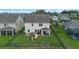 Expansive backyard with a playset, covered patio, and lush green lawn, perfect for outdoor enjoyment at 646 Marsh Reed Dr, Winter Garden, FL 34787