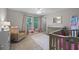 Cozy Bedroom with soothing colors, a glider, and soft carpeting at 646 Marsh Reed Dr, Winter Garden, FL 34787