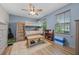 Comfortable bedroom with a bunk bed, ceiling fan and light laminate flooring at 646 Marsh Reed Dr, Winter Garden, FL 34787