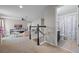 Bright bonus room featuring neutral walls, a ceiling fan, and an adjacent full bathroom at 646 Marsh Reed Dr, Winter Garden, FL 34787