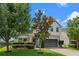 Inviting two-story home with charming curb appeal and a lush green lawn at 646 Marsh Reed Dr, Winter Garden, FL 34787