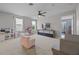 Spacious playroom filled with natural light, featuring a ceiling fan and plush carpeting at 646 Marsh Reed Dr, Winter Garden, FL 34787