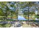Scenic pond view surrounded by mature trees, creating a peaceful and serene atmosphere at 646 Marsh Reed Dr, Winter Garden, FL 34787