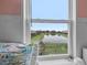 Charming window view overlooking a serene pond and lush backyard at 646 Marsh Reed Dr, Winter Garden, FL 34787