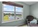 Enjoy tranquil water views from this charming window with a comfortable chair at 646 Marsh Reed Dr, Winter Garden, FL 34787