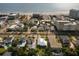 Stunning aerial view of charming homes near a pristine beach and oceanfront hotels at 725 N Grandview Ave, Daytona Beach, FL 32118