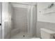 Bathroom showing a walk-in shower and tile surround at 725 N Grandview Ave, Daytona Beach, FL 32118