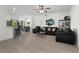 Open concept living room with hardwood floors, ceiling fan, a dining area, and lots of natural light at 725 N Grandview Ave, Daytona Beach, FL 32118