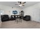 Bright living room with hardwood floors, modern ceiling fan, and an open layout with backyard view at 725 N Grandview Ave, Daytona Beach, FL 32118