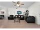 Spacious living room features bright hardwood floors, modern ceiling fan, and an open layout at 725 N Grandview Ave, Daytona Beach, FL 32118